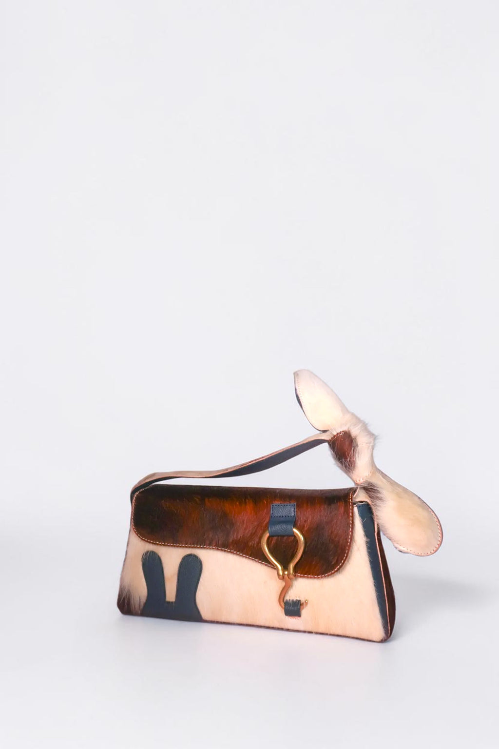 design Girls World blue & fur bunny ears shoulder bag with leather bow and gold clasp. Cowhide and leather.