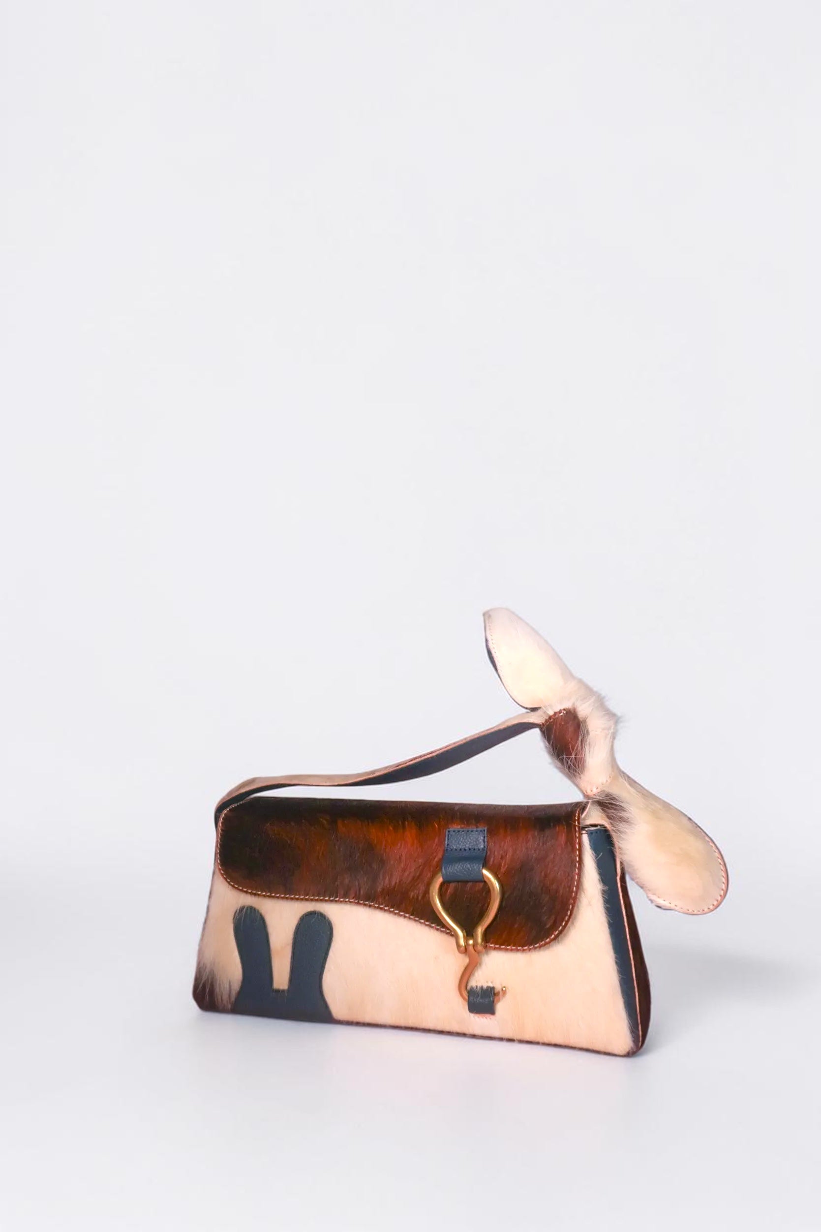 design Girls World blue & fur bunny ears shoulder bag with leather bow and gold clasp. Cowhide and leather.
