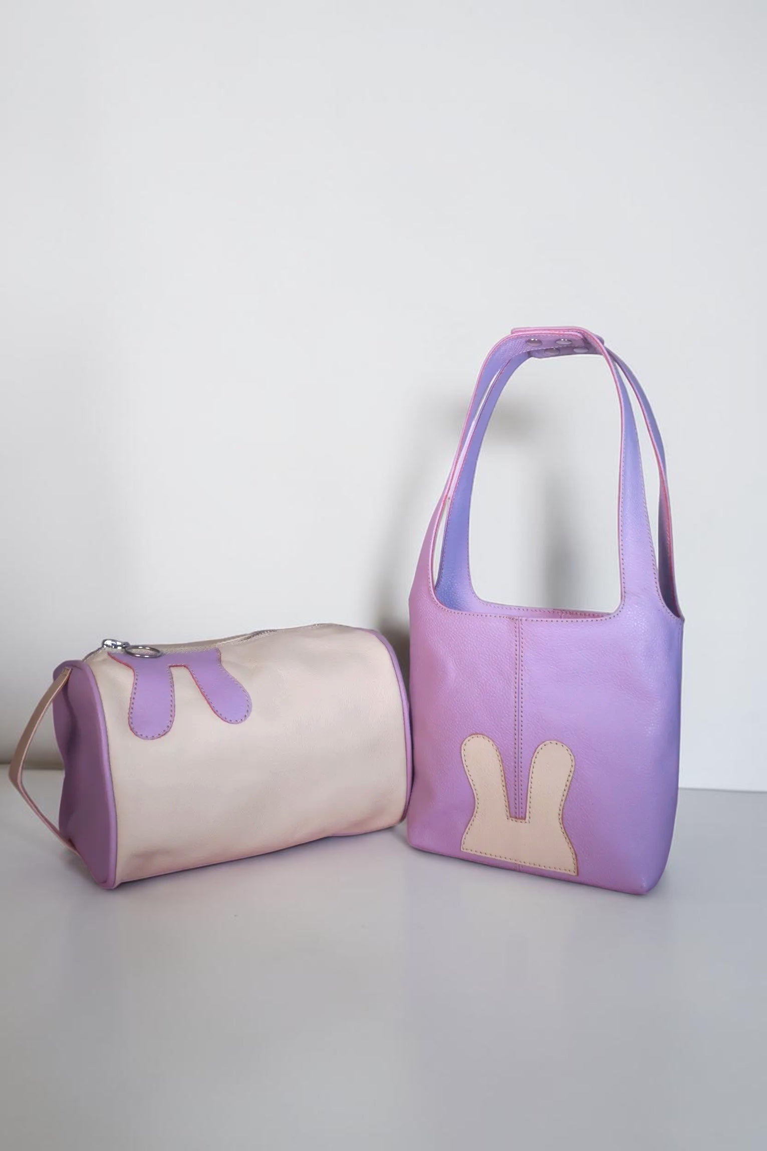 Design Girls World Mommy & Me lavender leather tote bag and cosmetic bag set with bunny details.